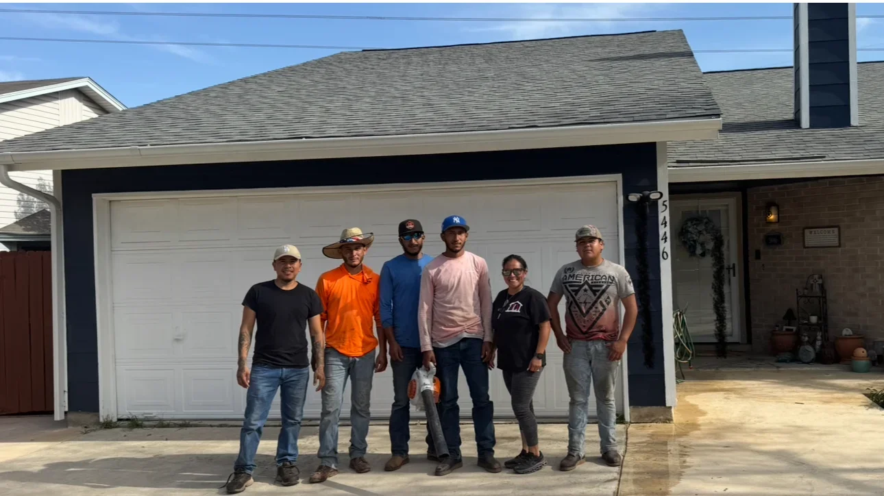New gray asphalt shingle roof installed on residential home with garage
