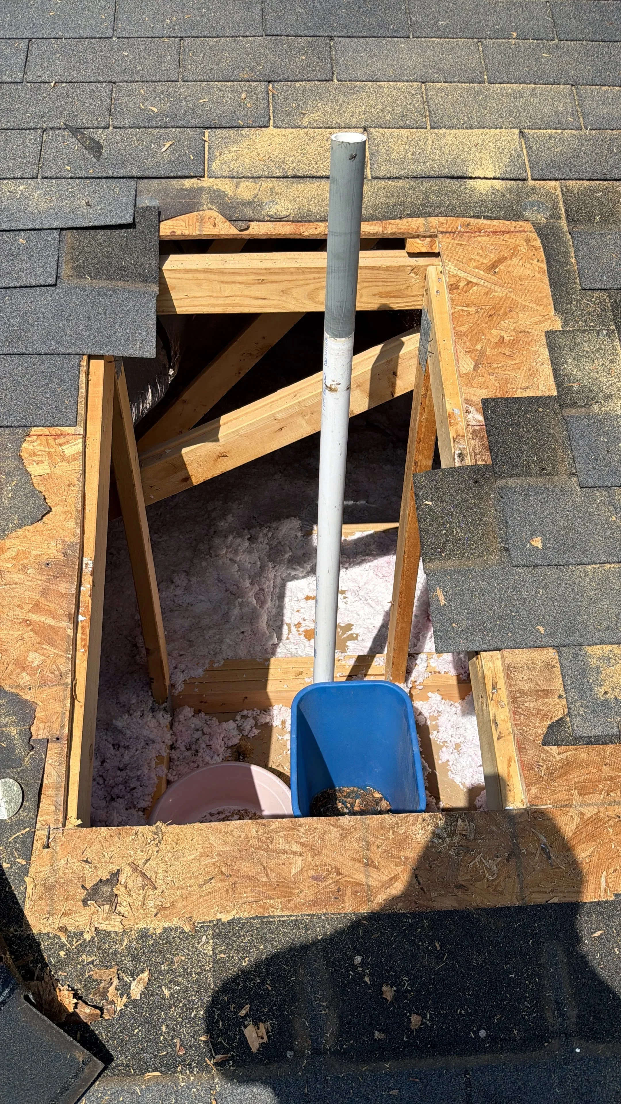Roof vent pipe installation with new flashing, lumber framing, and asphalt shingle replacement